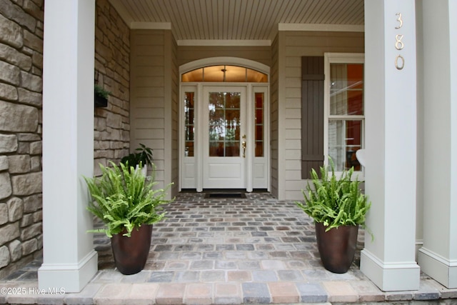 doorway to property featuring a porch