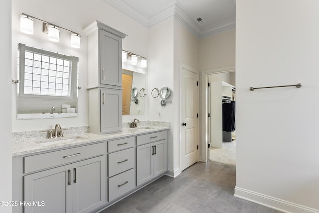 full bath featuring wood finished floors, a sink, ornamental molding, and visible vents