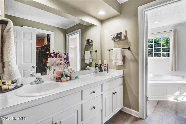 103 Roundtree Ln, Goldsboro, NC 27530 - full bath with double vanity, ornamental molding, baseboards, wood finished floors, and recessed lighting