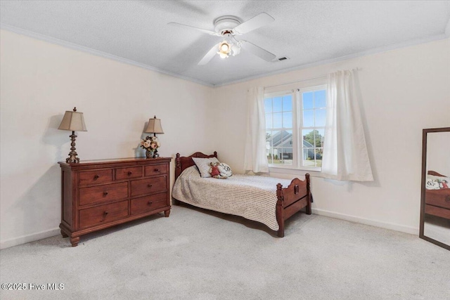 103 Roundtree Ln, Goldsboro, NC 27530 - bedroom featuring crown molding, light carpet, baseboards, ceiling fan, and a textured ceiling