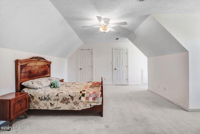 103 Roundtree Ln, Goldsboro, NC 27530 - carpeted bedroom featuring vaulted ceiling, baseboards, a textured ceiling, and a ceiling fan