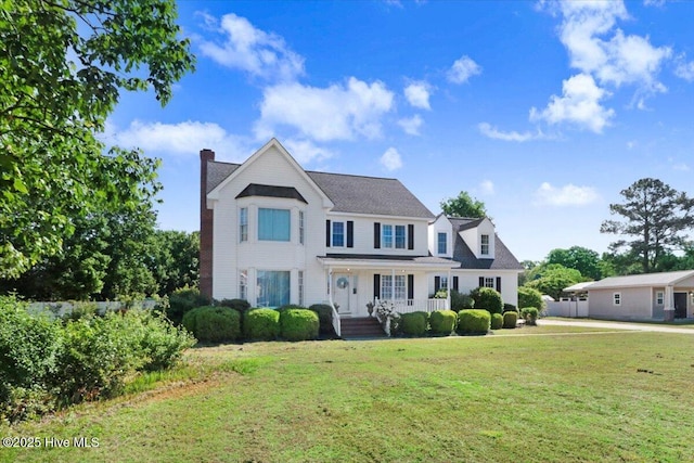 103 Roundtree Ln, Goldsboro, NC 27530 - view of front of property featuring a porch, a chimney, and a front yard