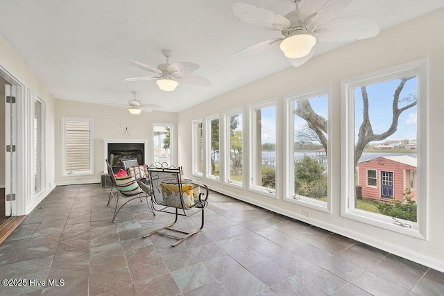 sunroom featuring baseboards