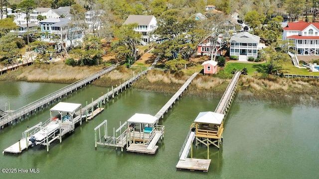 view of dock featuring boat lift and a water view