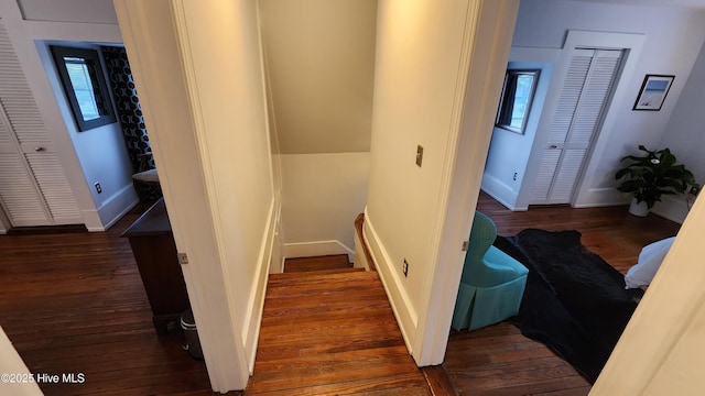 stairs with baseboards and wood finished floors