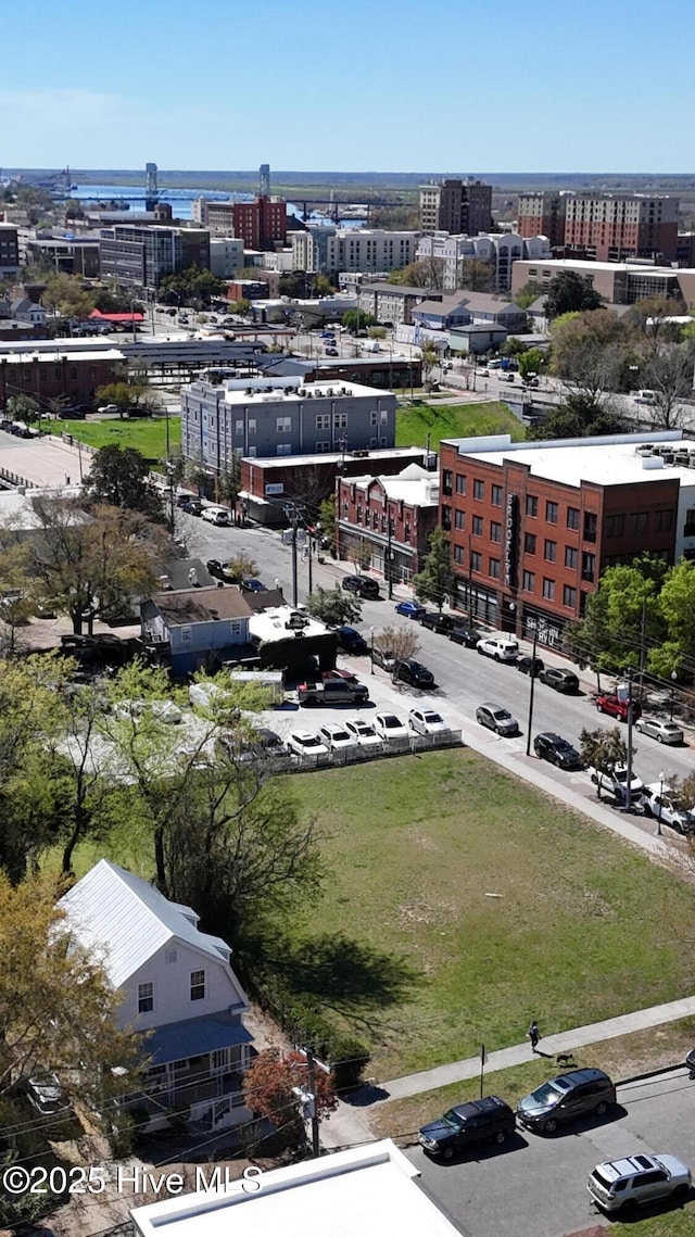 birds eye view of property with a view of city