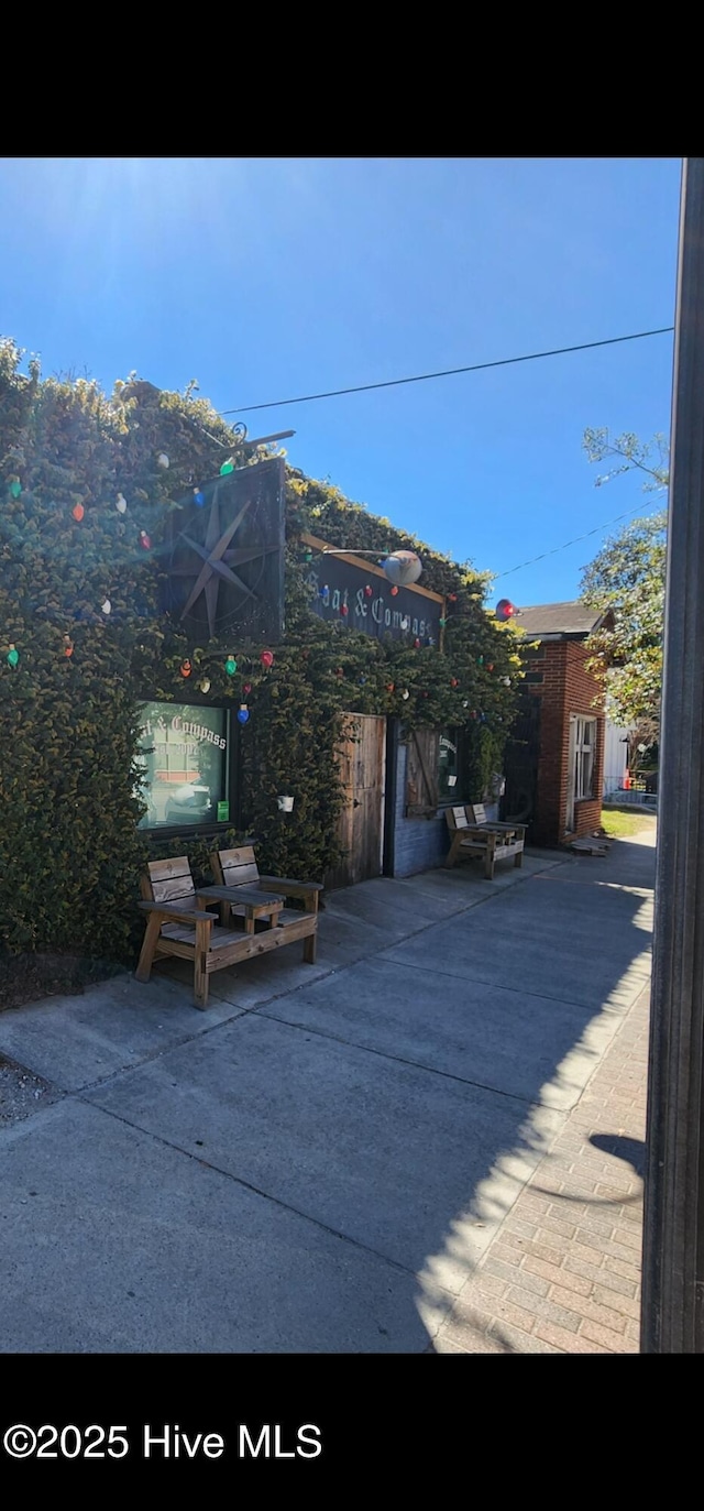 exterior space featuring an outdoor structure and a patio area