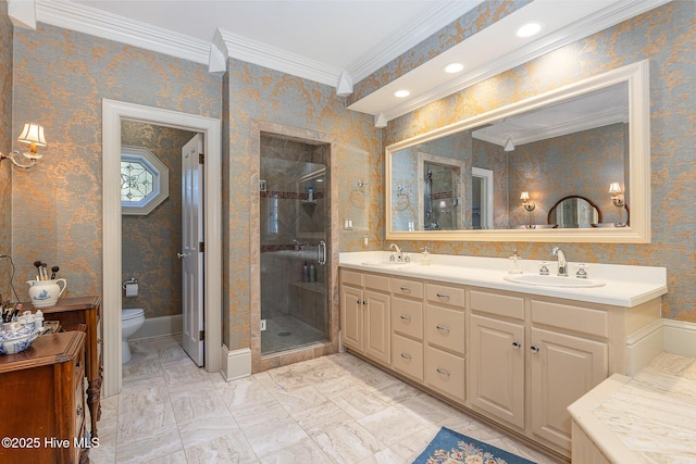 full bath with a sink, a stall shower, and crown molding