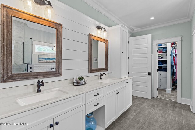 114 Sundance Cir, Hampstead, NC 28443 - full bathroom featuring double vanity, a tile shower, ornamental molding, and a spacious closet