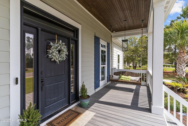 114 Sundance Cir, Hampstead, NC 28443 - view of exterior entry featuring a porch