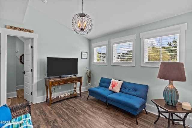 114 Sundance Cir, Hampstead, NC 28443 - living room featuring a chandelier, healthy amount of natural light, wood finished floors, vaulted ceiling, and baseboards