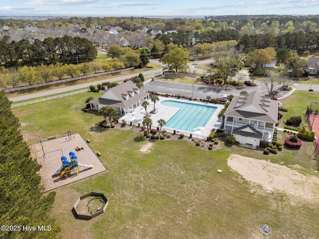 114 Sundance Cir, Hampstead, NC 28443 - aerial view of a pool area and a tree filled landscape