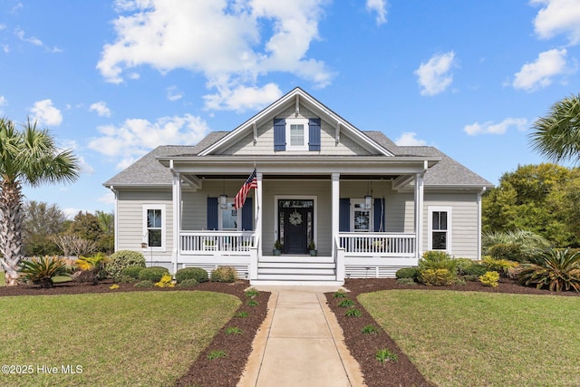 114 Sundance Cir, Hampstead, NC 28443 - view of front of property with a front yard, covered porch, and a shingled roof