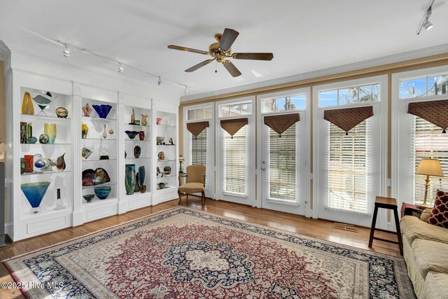 interior space featuring french doors, rail lighting, and visible vents