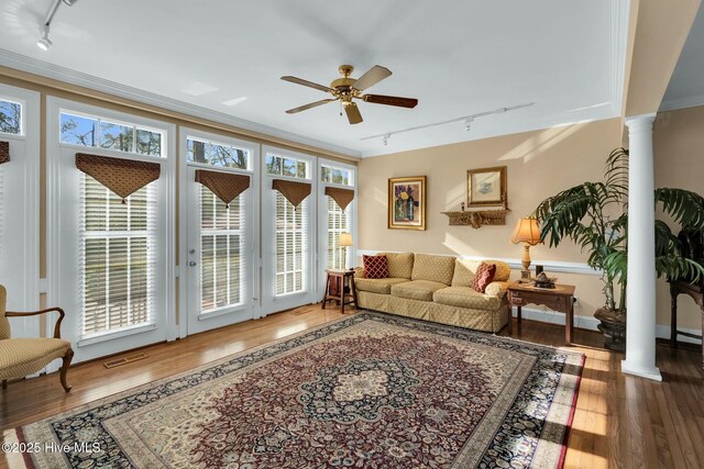 interior details with ornamental molding and wood finished floors