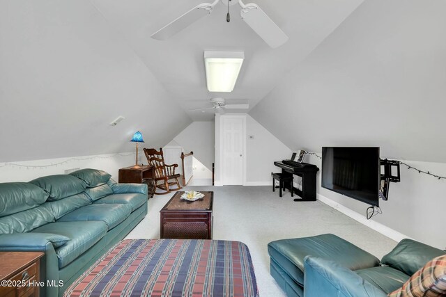 carpeted office space featuring baseboards, vaulted ceiling, and visible vents