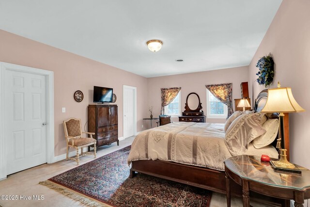 bedroom featuring baseboards