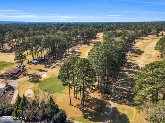 aerial view featuring a view of trees