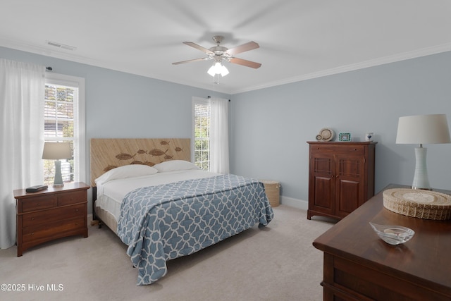 bedroom with ornamental molding, light colored carpet, and visible vents