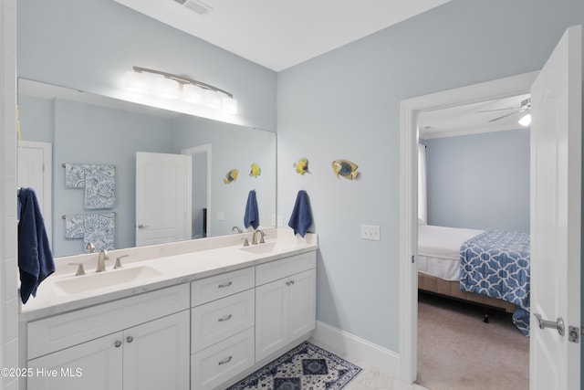 ensuite bathroom featuring double vanity, visible vents, a sink, and ensuite bath