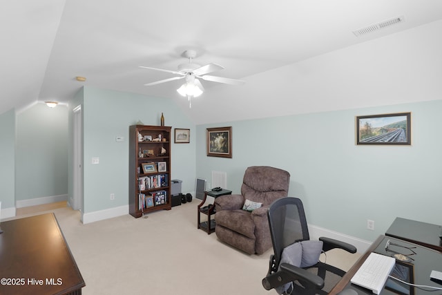 office area with visible vents, baseboards, ceiling fan, light carpet, and lofted ceiling