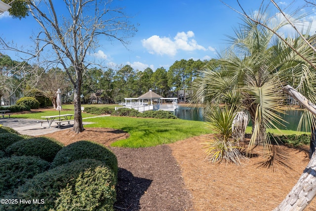 view of yard featuring a water view and a gazebo