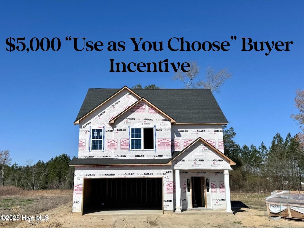 217 Talton Ests, Goldsboro, NC 27863 - property under construction with an attached garage and roof with shingles