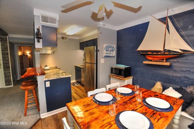 10170 Beach Dr SW Unit 305, Calabash, NC 28467 - dining area with ceiling fan and dark wood-type flooring