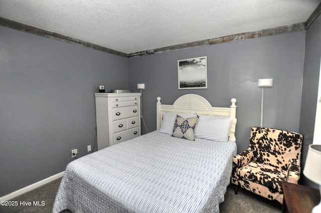 10170 Beach Dr SW Unit 305, Calabash, NC 28467 - carpeted bedroom with baseboards and a textured ceiling