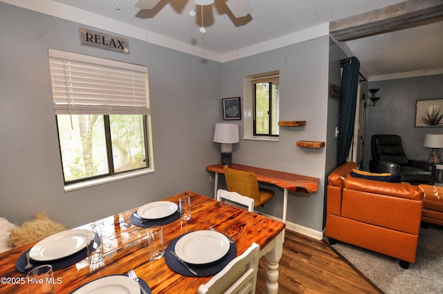 10170 Beach Dr SW Unit 305, Calabash, NC 28467 - dining space with wood finished floors, ceiling fan, a textured ceiling, and baseboards