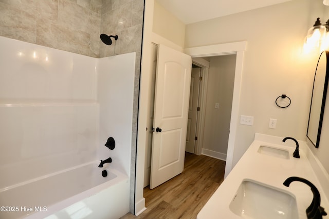 130 Gails Rd, West End, NC 27376 - bathroom with wood finished floors, shower / tub combination, and double vanity