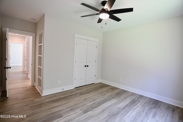 130 Gails Rd, West End, NC 27376 - unfurnished bedroom with a closet, wood finished floors, and ceiling fan