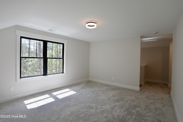 130 Gails Rd, West End, NC 27376 - spare room with light colored carpet, a smoke detector, and lofted ceiling