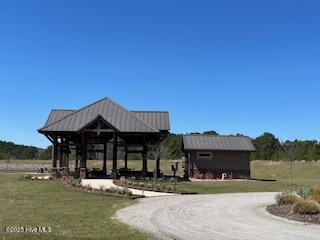 130 Gails Rd, West End, NC 27376 - view of home's community with a gazebo, a lawn, and curved driveway