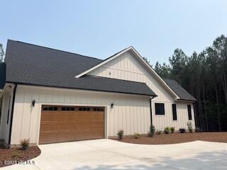 130 Gails Rd, West End, NC 27376 - modern farmhouse with concrete driveway and a garage