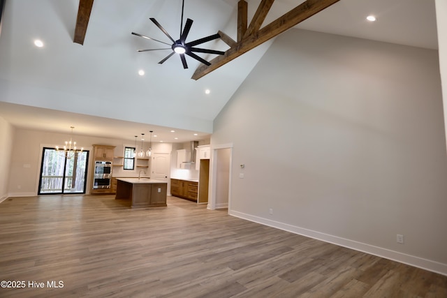 130 Gails Rd, West End, NC 27376 - unfurnished living room with a chandelier, high vaulted ceiling, beamed ceiling, ceiling fan, and recessed lighting