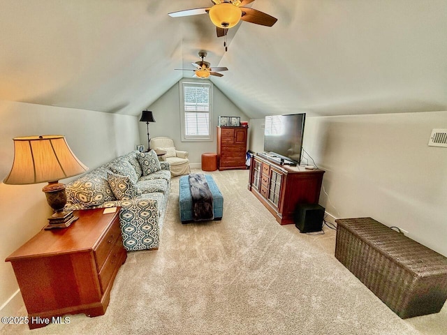carpeted living area with a ceiling fan, vaulted ceiling, and baseboards