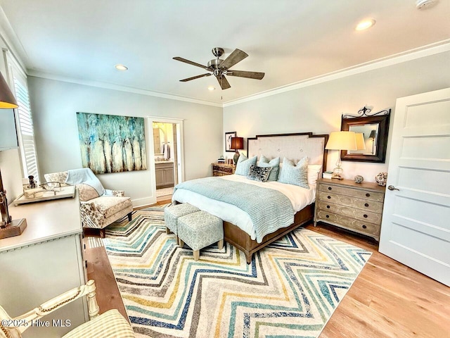 bedroom with recessed lighting, ceiling fan, ornamental molding, wood finished floors, and ensuite bathroom