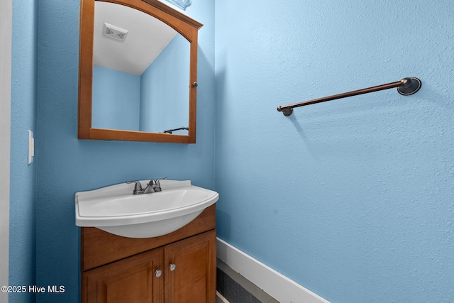 bathroom featuring vanity and visible vents