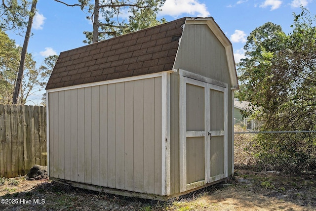 view of shed with fence