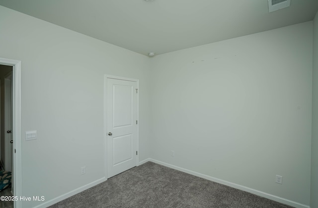 1741 Riverton Dr SE Lot 36, Bolivia, NC 28422 - spare room featuring baseboards, visible vents, and dark carpet