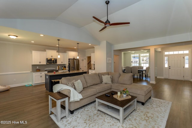 living room with baseboards, ceiling fan, recessed lighting, and dark wood finished floors
