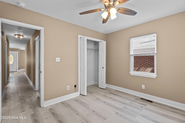 118 S 13th St, Wilmington, NC 28401 - unfurnished bedroom featuring visible vents, a closet, baseboards, light wood-type flooring, and a ceiling fan