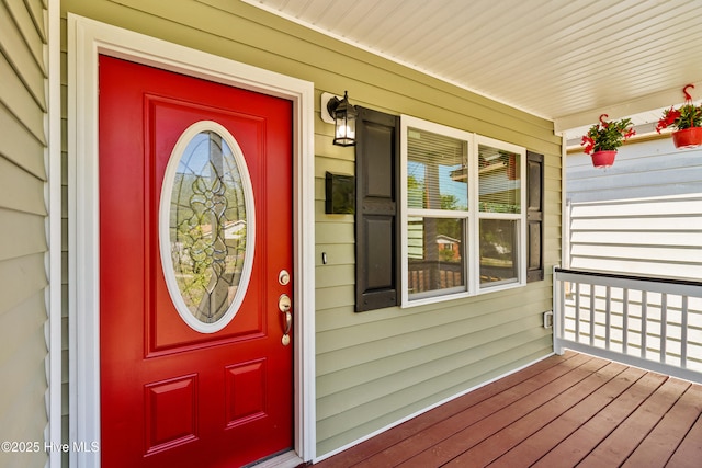 view of exterior entry with a porch