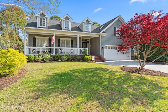 4106 Kittiwake Ct, Southport, NC 28461 - cape cod-style house featuring covered porch, concrete driveway, a front lawn, and roof with shingles