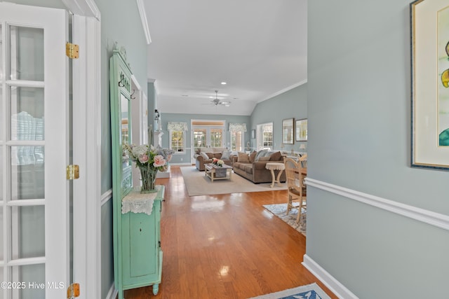 4106 Kittiwake Ct, Southport, NC 28461 - corridor with wood finished floors, ornamental molding, and baseboards