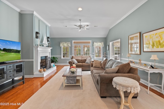 4106 Kittiwake Ct, Southport, NC 28461 - living area featuring light wood-type flooring, a ceiling fan, ornamental molding, a brick fireplace, and recessed lighting