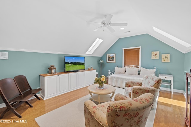 4106 Kittiwake Ct, Southport, NC 28461 - bedroom with a skylight, light wood-type flooring, lofted ceiling, ceiling fan, and baseboards
