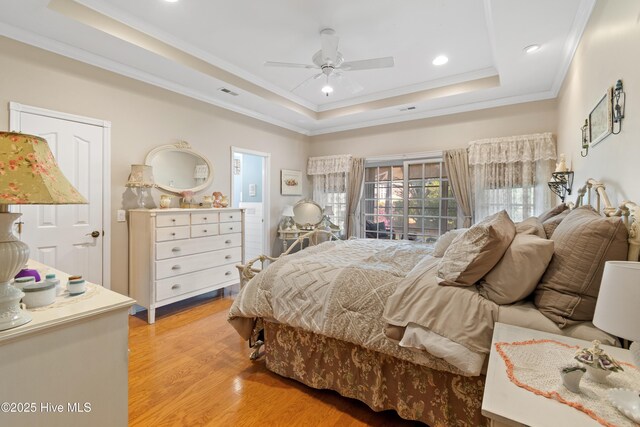 4106 Kittiwake Ct, Southport, NC 28461 - bedroom featuring a raised ceiling, ornamental molding, light wood-style flooring, access to outside, and recessed lighting
