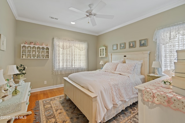 4106 Kittiwake Ct, Southport, NC 28461 - bedroom featuring wood finished floors, ornamental molding, baseboards, and ceiling fan